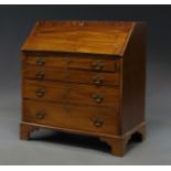 A George III mahogany bureau, fall front enclosing fitted interior, over four long drawers,