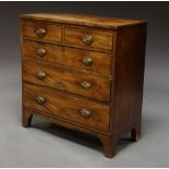 A George III mahogany chest of two short above three long drawers on splayed feet,