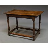 An elm and oak side table, late 17th/early 18th century, with turned legs joined by stretchers,