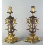 A pair of bronzed metal and gilt metal lamp bases, late 19th century,