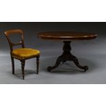 A plum pudding mahogany circular top table, 19th century, with bulbous turned pedestal,