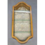 An oak framed wall mounted display cabinet, early 20th century, with single glazed door,