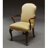 A Queen Anne style mahogany armchair, late 20th century, with cream upholstery, on cabriole legs,