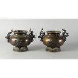 A pair of Japanese bronze censers, late 19th/early 20th century, with plum blossom handles,