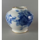 A Japanese porcelain vase by Okura, 20th century, painted with blue white roses on white ground,