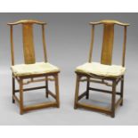 A pair of Chinese hardwood yoke back chairs, early 20th century,