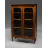 A French kingwood display cabinet, 19th century with two glazed doors enclosing three shelves,