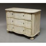 A bleached oak commode, in the Louis XV style, of recent manufacture, with three drawers,