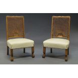 A pair of oak framed low chairs, c.