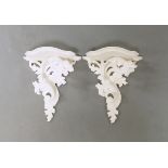 A set of three pairs of white painted wall brackets, with shaped plateau, on foliate supports,