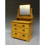 An Edwardian cherry wood dressing table, the mirror superstructure with shelf, on three drawer base,