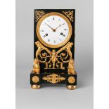 A French patinated bronze and gilt bronze clock, in the Egyptian taste, by Alexandre,