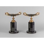 A pair of French Napoleon III bronze and gilt bronze twin handled tazze,