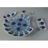 A Chinese blue and white dish, the interior rim decorated with flowers,