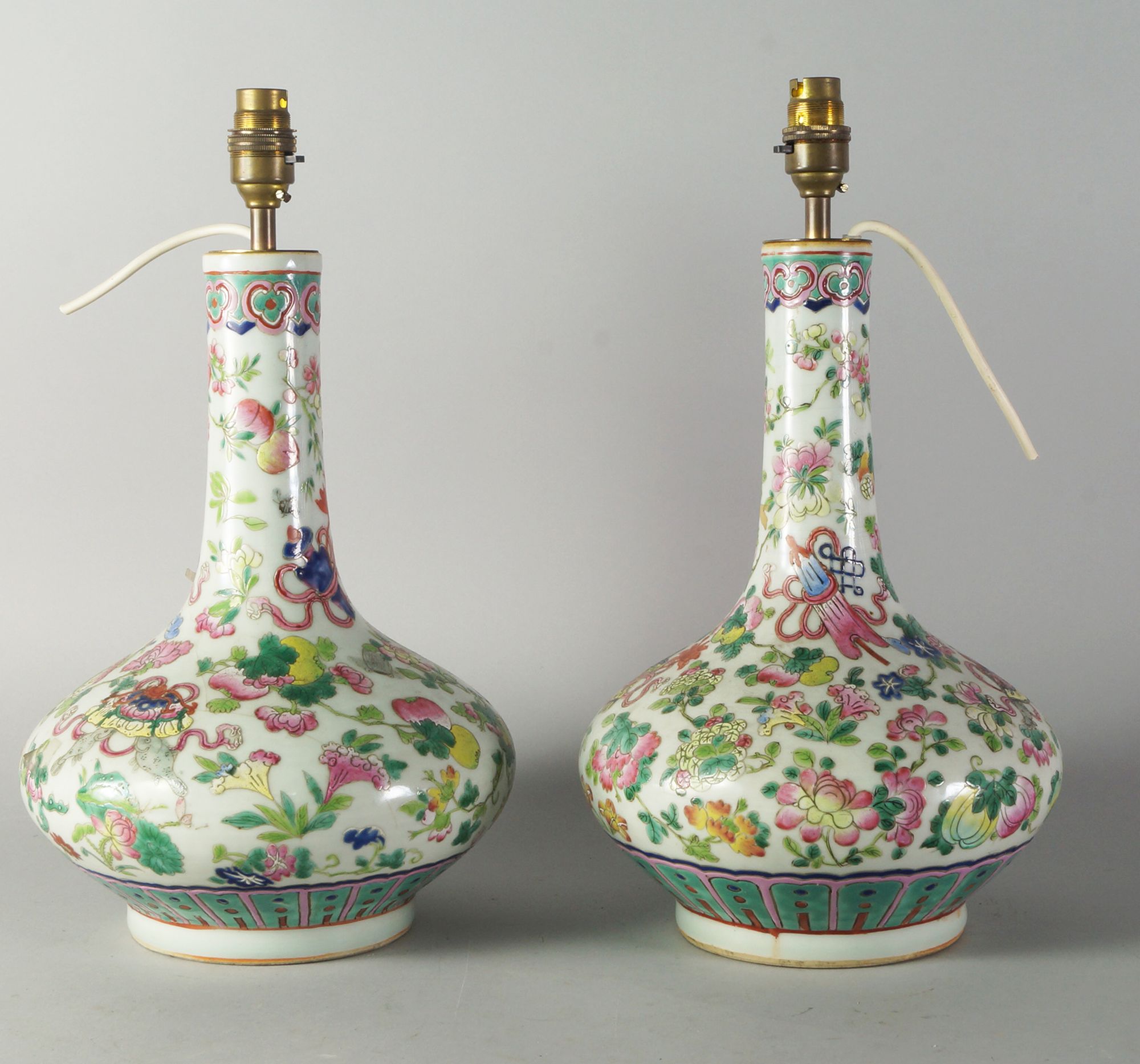 Two Chinese Canton bottle vases, early 20th century, decorated overall with flowers,