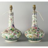 Two Chinese Canton bottle vases, early 20th century, decorated overall with flowers,