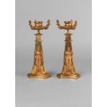 A pair of Empire taste gilt bronze candlesticks, 19th century,