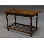 An oak rectangular side table, 18th century, with triple plank top,