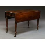 A Victorian mahogany Pembroke dining table the rounded rectangular top above single frieze drawer