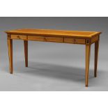 David Linley, a rectangular desk, three frieze drawers, on tapering legs,