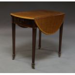 A George III Sheraton style mahogany and crossbanded oval Pembroke table,