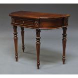 A mahogany side table by Cachet, 20th century, with shaped top with frieze drawer,