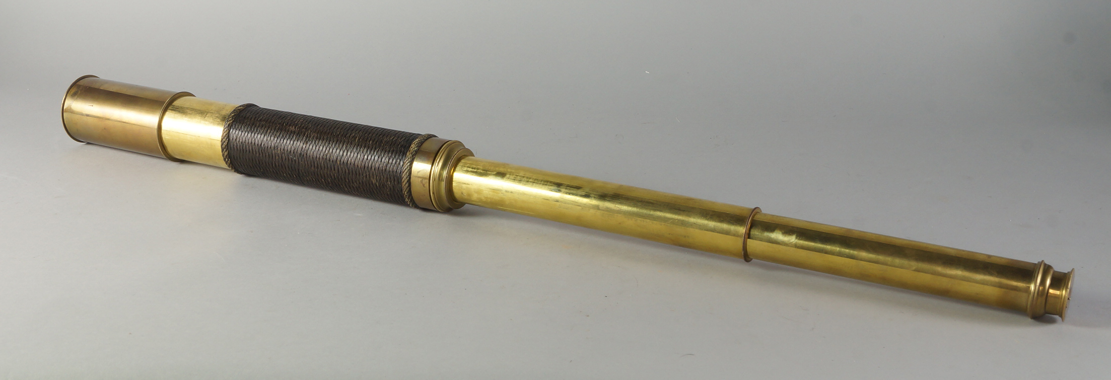 A Victorian three section drawer telescope, 19th century, with leather covered main barrel,