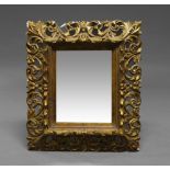 A Florentine style gilt wood and gesso mirror, 20th century,