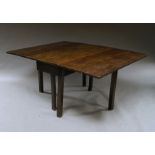 An oak drop leaf dining table, 18th century, on square chamfered legs,