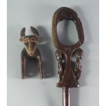 A Tribal heddle pully, late 19th/20th century, modelled with the head of an ox, 16cm high,