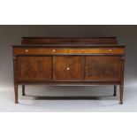 An Edwardian mahogany rectangular sideboard, with two frieze drawers,