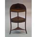 A George III mahogany corner washstand, with shaped gallery top,