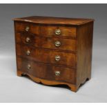 A George III mahogany serpentine chest of drawers, with two short and three long graduated drawers,