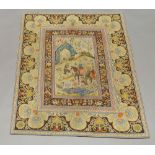A small needlework rug with pictorial panel, enclosed by a border portraying hunting scenes,
