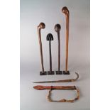 Three West African hardwood knobkerries, late 19th/20th century, of plain form,