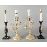 A pair of black lacquered candle stick lamp bases, 20th century, decorated with flowers,