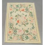 A modern floral needlework rug,