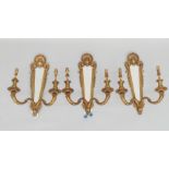 A set of three girandole style twin branch wall lights, 20th century,