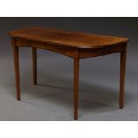 A George III mahogany side table on square tapering supports,