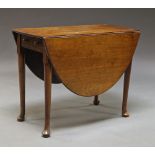 A George III mahogany table with two flaps, with frieze drawer, on long cabriole legs,