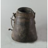 An African leather milk flask, late 19th/20th century, with woven rope work rim,
