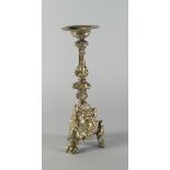 A Continental brass candlestick, Spanish or Italian, 17th century, on paw feet,