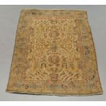 An antique Persian tapestry hanging with Islamic banner over flower and leaf ivory coloured field,