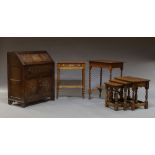 An oak bureau, mid 20th century, together with a nest of three elm side tables,