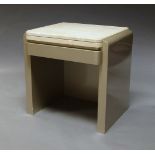 A silver lacquered MDF dressing table, of recent manufacture, with shaped marble top,