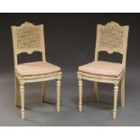 A pair of French Louis XVI style white painted bedroom chairs, 20th century,