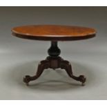 A Victorian mahogany centre table, with circular top, supported on a turned bulbous column,