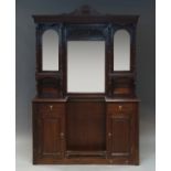 A large Edwardian mahogany mirror back hall stand with carved pediment above three bevelled plates