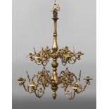 A large brass two tier twelve branch chandelier, late 19th/early 20th century,