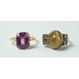 A cats-eye agate and diamond ring, of 1940s Retro design, the cabochon cats-eye mounted in white